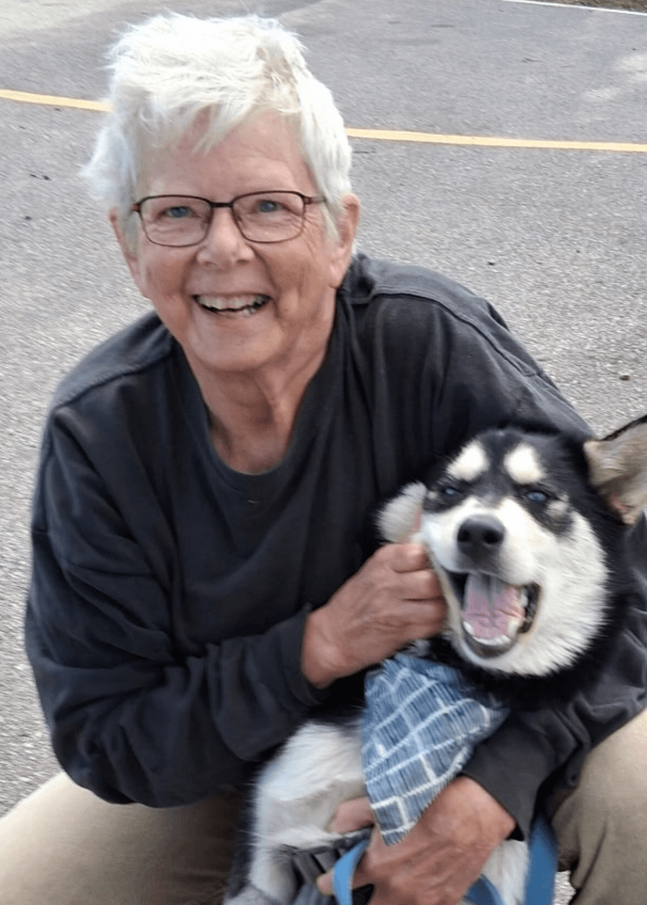 shelly holding a dog